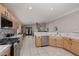 Bright kitchen featuring stainless steel appliances and a tiled backsplash at 7697 Morning Lake Dr, Las Vegas, NV 89131