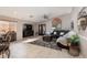 Spacious living room with vaulted ceilings, tile flooring, and lots of natural light at 7697 Morning Lake Dr, Las Vegas, NV 89131