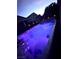 Inviting backyard pool, illuminated with vibrant lighting, offers a relaxing outdoor retreat at 7697 Morning Lake Dr, Las Vegas, NV 89131