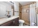 Bathroom featuring a shower with tiled walls and updated vanity at 7984 Laurena Ave, Las Vegas, NV 89147