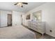 Cozy bedroom with wood-look flooring and a spacious dresser with mirror at 7984 Laurena Ave, Las Vegas, NV 89147