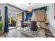 Elegantly decorated dining area with stylish curtains, a chandelier, and patio access at 7984 Laurena Ave, Las Vegas, NV 89147