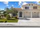 Beautiful two-story home with arched doorway to private entrance and a convenient two-car garage at 7984 Laurena Ave, Las Vegas, NV 89147