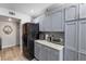 Kitchen featuring gray cabinets, granite countertops, and stainless steel appliances at 7984 Laurena Ave, Las Vegas, NV 89147