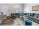Inviting living room featuring a comfortable seating arrangement and large bright window at 7984 Laurena Ave, Las Vegas, NV 89147