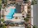 Aerial view of community pool with unique shape, cabana, lounge chairs and lush landscaping at 7984 Laurena Ave, Las Vegas, NV 89147