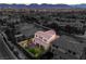 Aerial view of the property highlighting the custom patio, lush landscaping, and firepit area at 8126 Majestic Bighorn St, Las Vegas, NV 89166