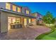 Spacious backyard with a covered patio, outdoor dining, and a putting green, ideal for outdoor living at 8126 Majestic Bighorn St, Las Vegas, NV 89166