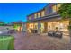 Beautifully landscaped backyard with a putting green, covered patio, and comfortable seating areas, great for relaxing at 8126 Majestic Bighorn St, Las Vegas, NV 89166