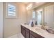 Beautiful bathroom with double sinks, quartz counters, and stylish lighting fixtures at 8126 Majestic Bighorn St, Las Vegas, NV 89166