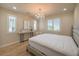 Bedroom featuring ample natural light, chandelier, and a cozy bed set against a light-toned wall at 8126 Majestic Bighorn St, Las Vegas, NV 89166