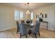Elegant dining room featuring modern lighting, stylish furnishings, and seamless indoor-outdoor living at 8126 Majestic Bighorn St, Las Vegas, NV 89166