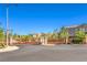 Community entrance with a gate and lush landscaping, enhancing the neighborhood's curb appeal at 8126 Majestic Bighorn St, Las Vegas, NV 89166