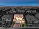 Exterior aerial view of the home highlighting its charming facade, manicured lawn, and surrounding neighborhood at 8126 Majestic Bighorn St, Las Vegas, NV 89166