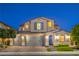 Elegant two-story home showcasing a three-car garage and well-manicured landscaping at 8126 Majestic Bighorn St, Las Vegas, NV 89166