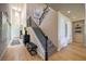 Elegant foyer with staircase, chandelier, and hardwood floors creates a welcoming entrance at 8126 Majestic Bighorn St, Las Vegas, NV 89166