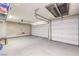 Spacious two car garage with speckled floor and two white paneled doors at 8126 Majestic Bighorn St, Las Vegas, NV 89166