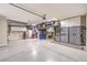 Spacious garage with storage cabinets, epoxy floor, and overhead storage racks at 8126 Majestic Bighorn St, Las Vegas, NV 89166