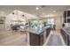 Spacious kitchen with a large island, seamlessly flowing into a bright and airy living area at 8126 Majestic Bighorn St, Las Vegas, NV 89166