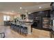 Spacious kitchen with island, barstool seating, and stainless steel appliances at 8126 Majestic Bighorn St, Las Vegas, NV 89166