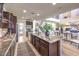 Open-concept kitchen featuring a granite island, modern appliances, and an inviting breakfast bar at 8126 Majestic Bighorn St, Las Vegas, NV 89166