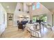 Bright and spacious living room with hardwood floors, soaring ceilings and sliding doors to the backyard at 8126 Majestic Bighorn St, Las Vegas, NV 89166