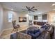 Comfortable upstairs living room with a large sectional, wet bar, and media center at 8126 Majestic Bighorn St, Las Vegas, NV 89166