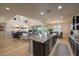 Bright, open-concept layout with kitchen island and a seamless transition to the living room and dining area at 8126 Majestic Bighorn St, Las Vegas, NV 89166