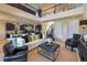 Open-concept living room boasts high ceilings, modern furnishings, and a seamless flow to the kitchen at 8126 Majestic Bighorn St, Las Vegas, NV 89166