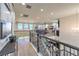 Large upstairs loft with hardwood floors, comfortable seating, and a view of the downstairs living area at 8126 Majestic Bighorn St, Las Vegas, NV 89166