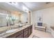 Spacious main bathroom featuring double sinks, a shower, a soaking tub, and a vanity area at 8126 Majestic Bighorn St, Las Vegas, NV 89166