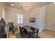 Chic office showcasing a chandelier, unique desk, and large window for natural light at 8126 Majestic Bighorn St, Las Vegas, NV 89166
