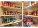 Well-stocked pantry features an array of canned goods and ample shelving for organized storage at 8126 Majestic Bighorn St, Las Vegas, NV 89166