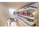 Bright walk-in closet featuring an abundance of shelving for shoes, purses, and clothing at 8126 Majestic Bighorn St, Las Vegas, NV 89166