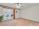 Spacious bedroom with doors leading to the outside and a ceiling fan at 8316 Vibrant Dr, Las Vegas, NV 89117