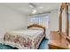 Comfortable bedroom features a ceiling fan, a window, and a nice dresser at 8316 Vibrant Dr, Las Vegas, NV 89117