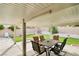 Covered patio with outdoor seating, views of the landscaped backyard and rock garden feature at 8316 Vibrant Dr, Las Vegas, NV 89117