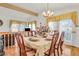 Inviting dining room featuring wood floors, natural light, and elegant decor at 8316 Vibrant Dr, Las Vegas, NV 89117