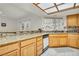 Charming kitchen features light wood cabinets, granite countertops, and a tile backsplash at 8316 Vibrant Dr, Las Vegas, NV 89117