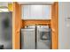 Convenient laundry room with washer, dryer, and storage cabinets at 8316 Vibrant Dr, Las Vegas, NV 89117