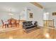 Open concept living room and dining area with wood floors and comfortable seating at 8316 Vibrant Dr, Las Vegas, NV 89117