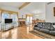 Spacious living room with hardwood floors, fireplace, and adjacent dining area at 8316 Vibrant Dr, Las Vegas, NV 89117