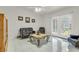 Bright living room with tile floors, elegant furniture, and French doors to the backyard at 8316 Vibrant Dr, Las Vegas, NV 89117