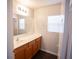 Well-lit bathroom features a vanity with storage and a large mirror and functional design at 9526 Borough Park St, Las Vegas, NV 89178
