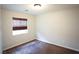 Bedroom with plush carpet, window with blind and a ceiling light, which provides comfort and privacy at 9526 Borough Park St, Las Vegas, NV 89178