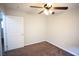 This bedroom features plush carpet, neutral walls and a ceiling fan, and bright at 9526 Borough Park St, Las Vegas, NV 89178