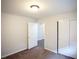 Spacious bedroom with plush carpet, bright light fixture and dual closets, providing ample storage at 9526 Borough Park St, Las Vegas, NV 89178