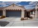 Charming single-story home featuring a two-car garage and well-maintained front yard landscaping at 9526 Borough Park St, Las Vegas, NV 89178