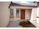 Inviting front entrance with a colorful flower bed and well-maintained surroundings at 9526 Borough Park St, Las Vegas, NV 89178
