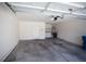 A spacious garage with concrete floors, white walls, and access to laundry facilities at 9526 Borough Park St, Las Vegas, NV 89178